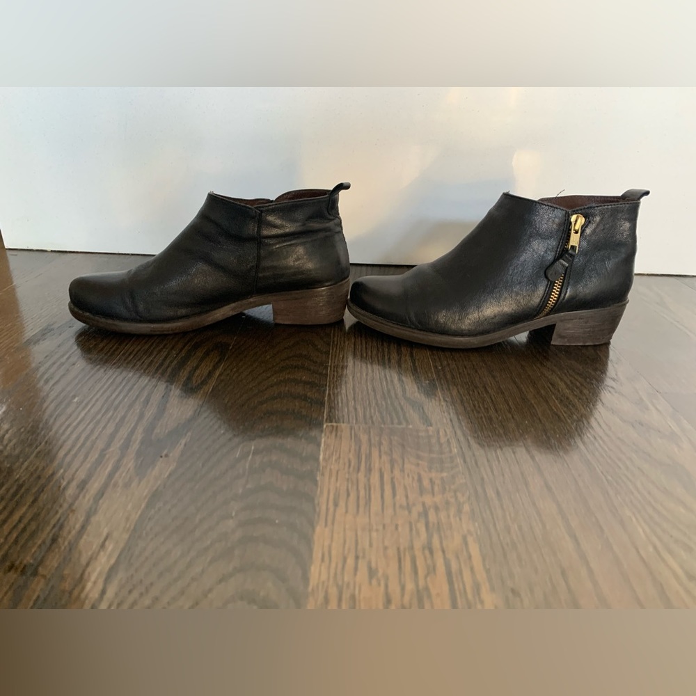 Black leather booties with side zipper. Very comfortable.  Great condition.
